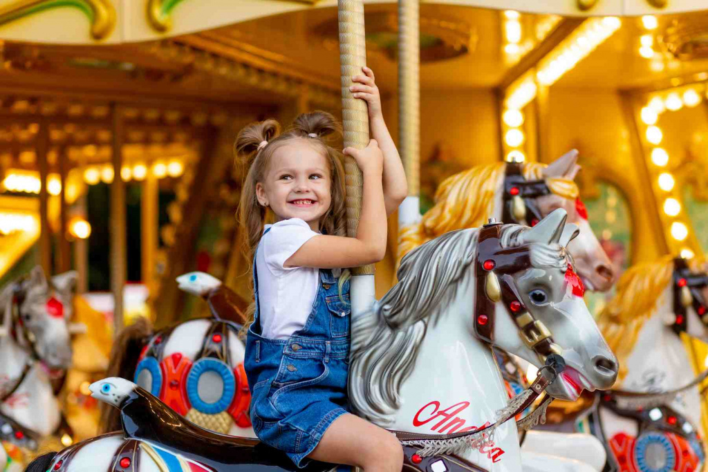 happy-girl-amusement-park-rides-horse-carousel-summer (1).jpg