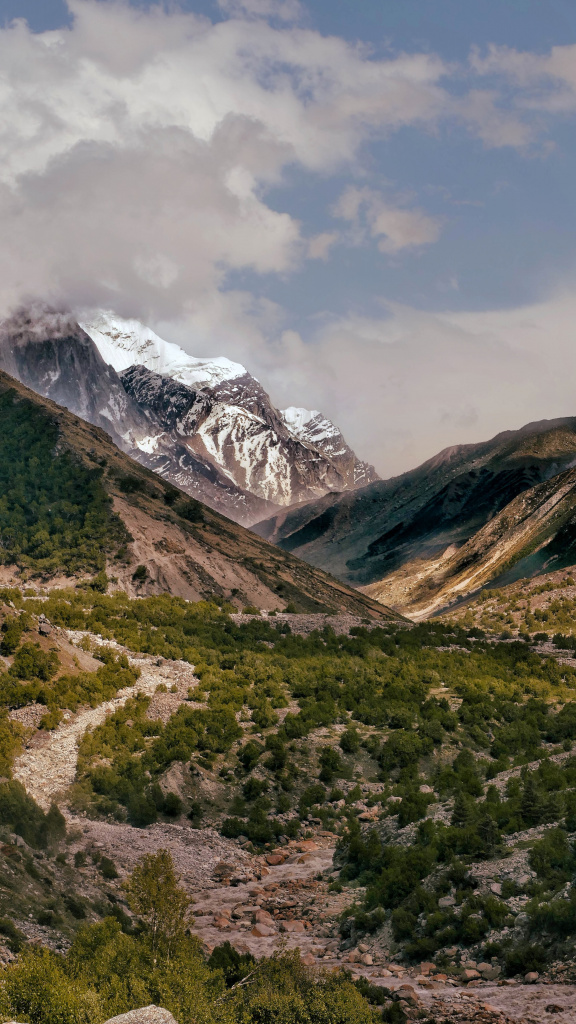 vertical-shot-ganga-river-with-snow-covered-mountains (1).jpg